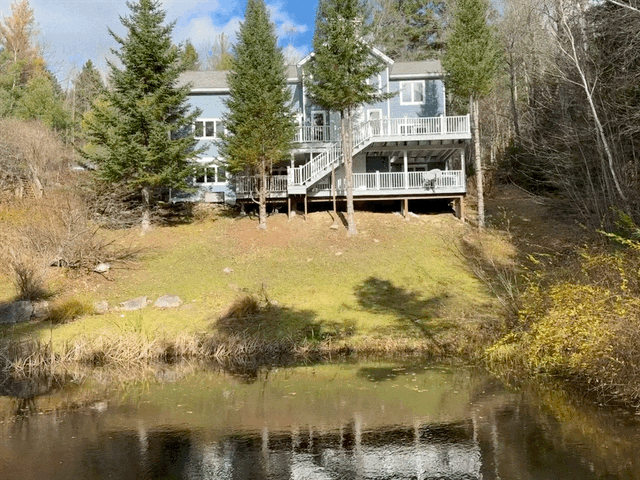 back exterior of 4-bedroom airbnb in vermont with private pond